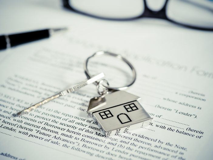 House document with keys and pen
